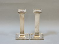 Lot 179 - A pair of silver candlesticks