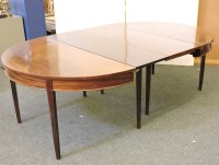 Lot 628 - A George III and later mahogany dining table