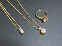 Lot 81 - Two 9ct gold cubic zirconia single stone pendants