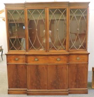 Lot 651 - A reproduction mahogany breakfront secretaire bookcase