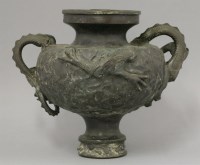 Lot 583 - A bronze urn