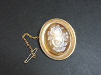 Lot 76 - A 9ct gold carved roses shell cameo brooch