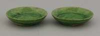 Lot 9 - A pair of small green-glazed Dishes