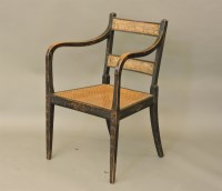 Lot 566 - A Regency ebonised and painted elbow chair