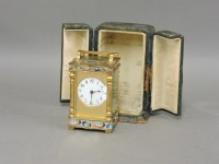 Lot 225 - A champlevé enamel carriage clock