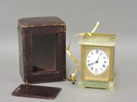 Lot 215 - An onyx carriage timepiece