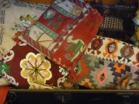 Lot 395 - Two suitcases of textiles