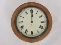 Lot 483 - An oak wall clock