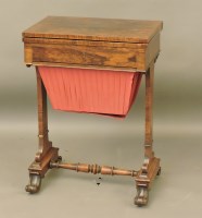 Lot 658 - A Regency rosewood fold over work table