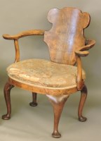 Lot 668 - A Queen Anne style walnut library chair