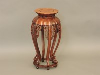 Lot 620 - A Chinese wooden jardinière stand