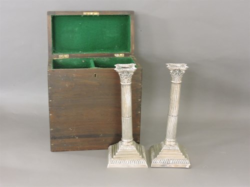 Lot 212 - A pair of Georgian style silver corinthian column candlesticks
