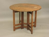 Lot 626 - A circular light oak gateleg table