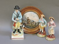 Lot 234 - Three Staffordshire pottery figures