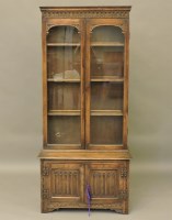 Lot 611 - An old reproduction bookcase