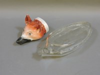 Lot 212 - A Victorian pottery fox mask stirrup cup
