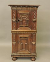 Lot 594 - A 17th century style small carved oak cupboard