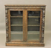 Lot 599 - A Victorian carved oak bookcase