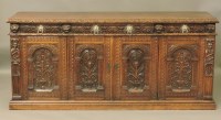 Lot 655 - A Victorian carved oak sideboard