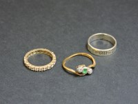 Lot 16 - A gold synthetic spinel full eternity ring
