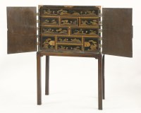 Lot 467 - A Japanese black lacquered cabinet