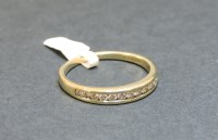 Lot 4 - A 9ct gold diamond set half eternity ring