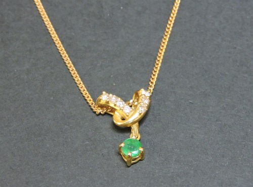 Lot 32 - An 18ct gold emerald and diamond pendant