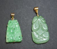 Lot 41 - Two 9ct gold carved jade pendants