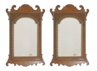 Lot 668 - A pair of Victorian walnut wall mirrors