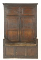 Lot 450 - An oak bacon settle