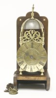 Lot 410 - A brass lantern clock