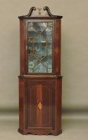 Lot 601 - A mahogany inlaid two part glazed corner cupboard