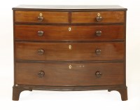 Lot 574 - A George III mahogany bow front chest