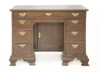 Lot 656 - A George III mahogany kneehole desk