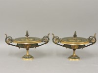 Lot 259 - A pair of Empire style bronze two handled bonbonnières and covers