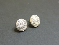 Lot 109 - A pair of 9ct gold pavé set diamond stud earrings