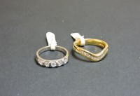 Lot 57 - A 9ct white gold diamond set band ring
