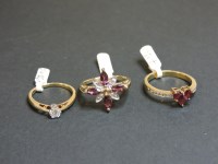 Lot 60 - A 9ct gold heart shaped ruby cluster ring