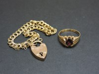 Lot 95 - A 9ct gold garnet ring