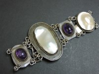 Lot 23 - An Arts and Crafts silver blister pearl and amethyst bracelet