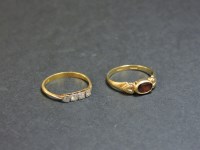 Lot 24 - A 9ct gold garnet ring