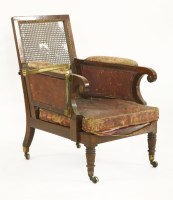 Lot 648 - A William IV mahogany campaign bergère elbow chair