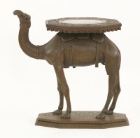 Lot 649 - A well carved hardwood camel table