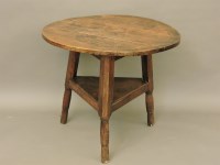 Lot 639 - A 19th century fruit wood cricket table