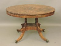 Lot 673 - A Regency rosewood and brass inlaid centre table