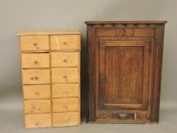 Lot 680 - A 19th century oak and mahogany corner cupboard