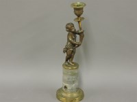 Lot 220 - A gilt bronze and marble cherub candlestick