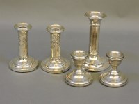 Lot 212 - Two pairs of dwarf silver candlesticks