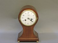 Lot 273 - An Edwardian strung mahogany balloon mantel clock