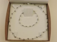 Lot 63 - A white gold wavy bar necklace and bracelet suite